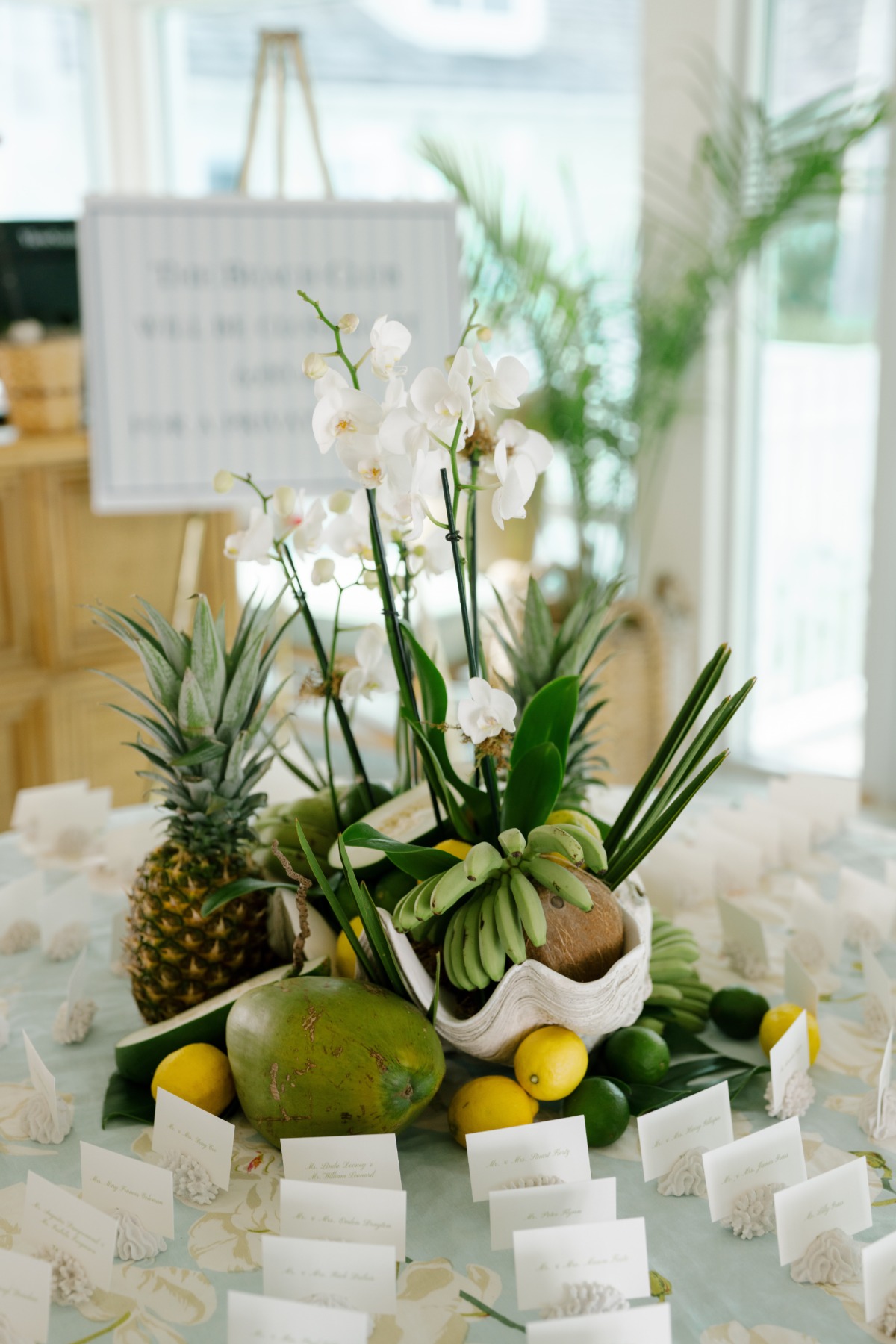 Tropical inspired table with name cards at a wedding