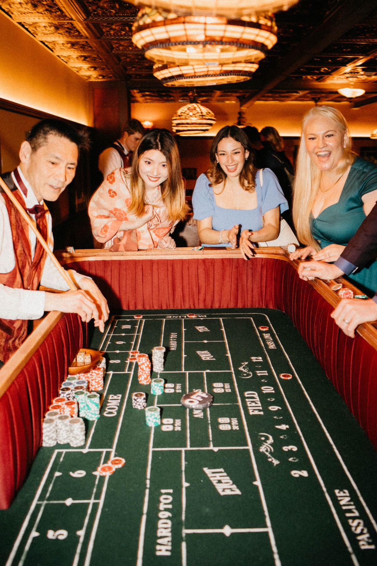 end of table photo of people playing craps in casino