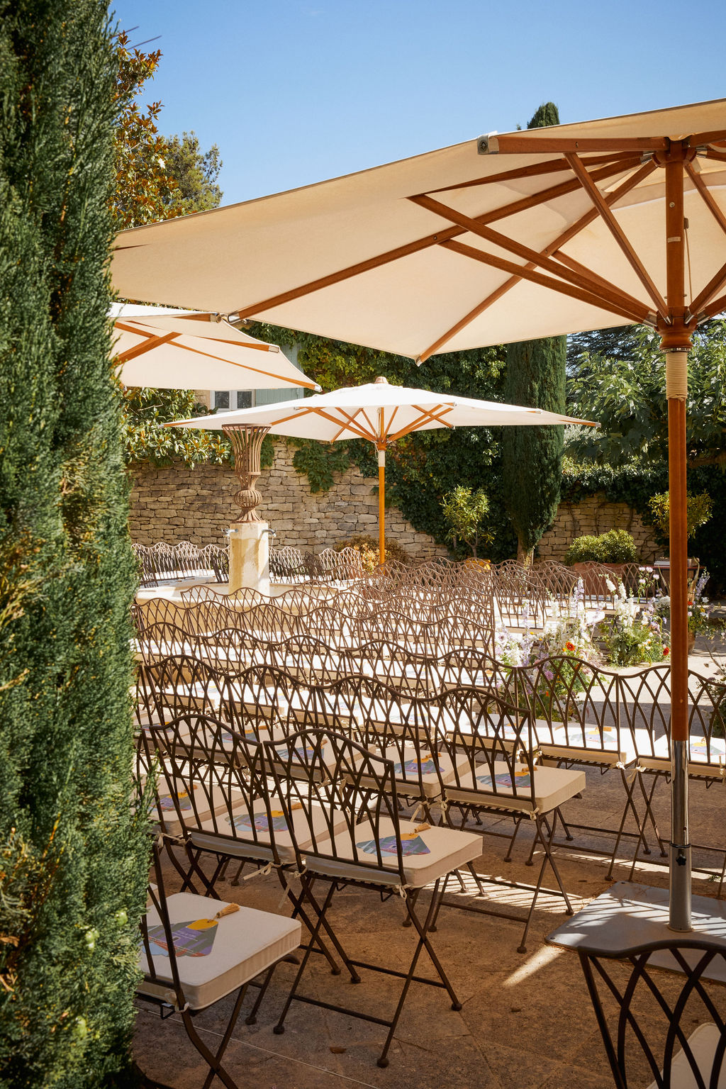 wedding ceremony with sun umbrellas for shade