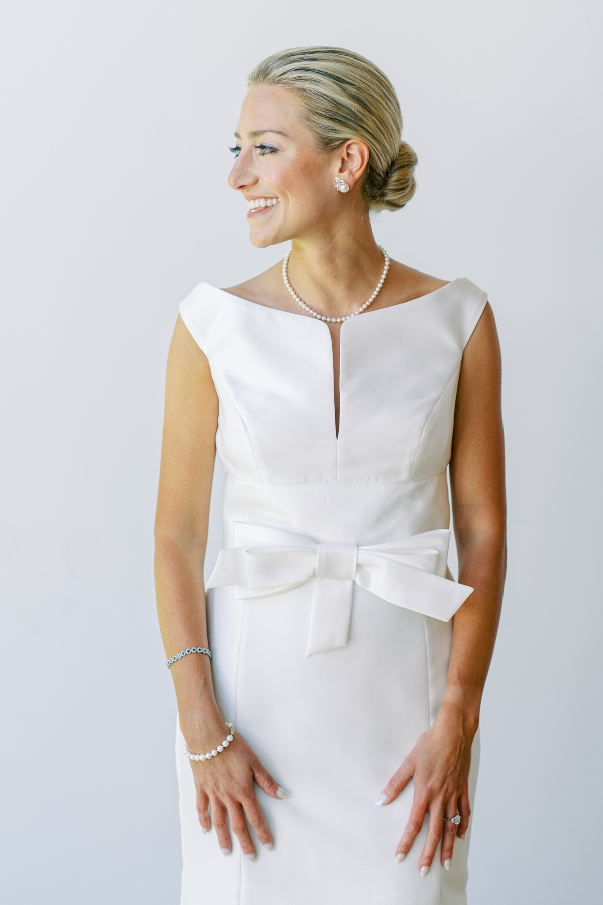 bows and pearl wedding dress
