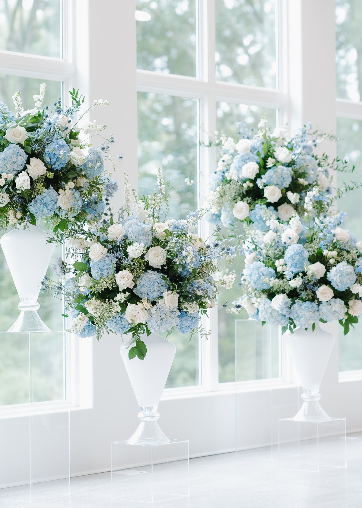large blue and white floral arrangements for wedding ceremony