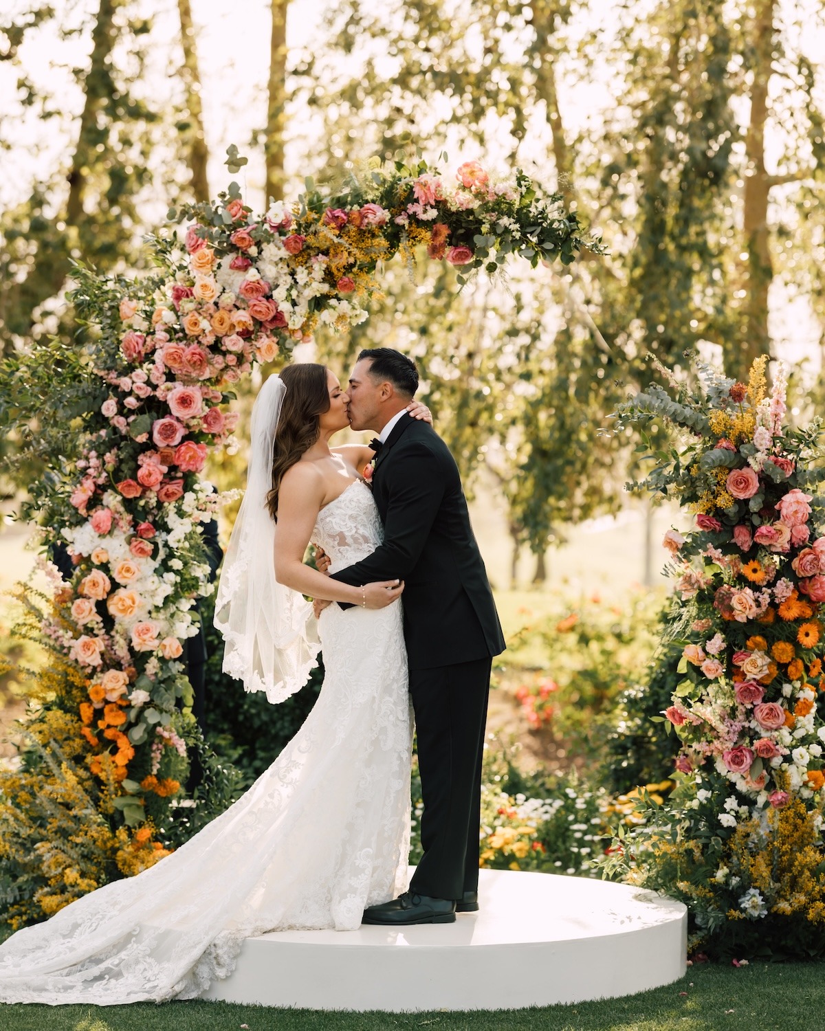 citrus colored floral arch