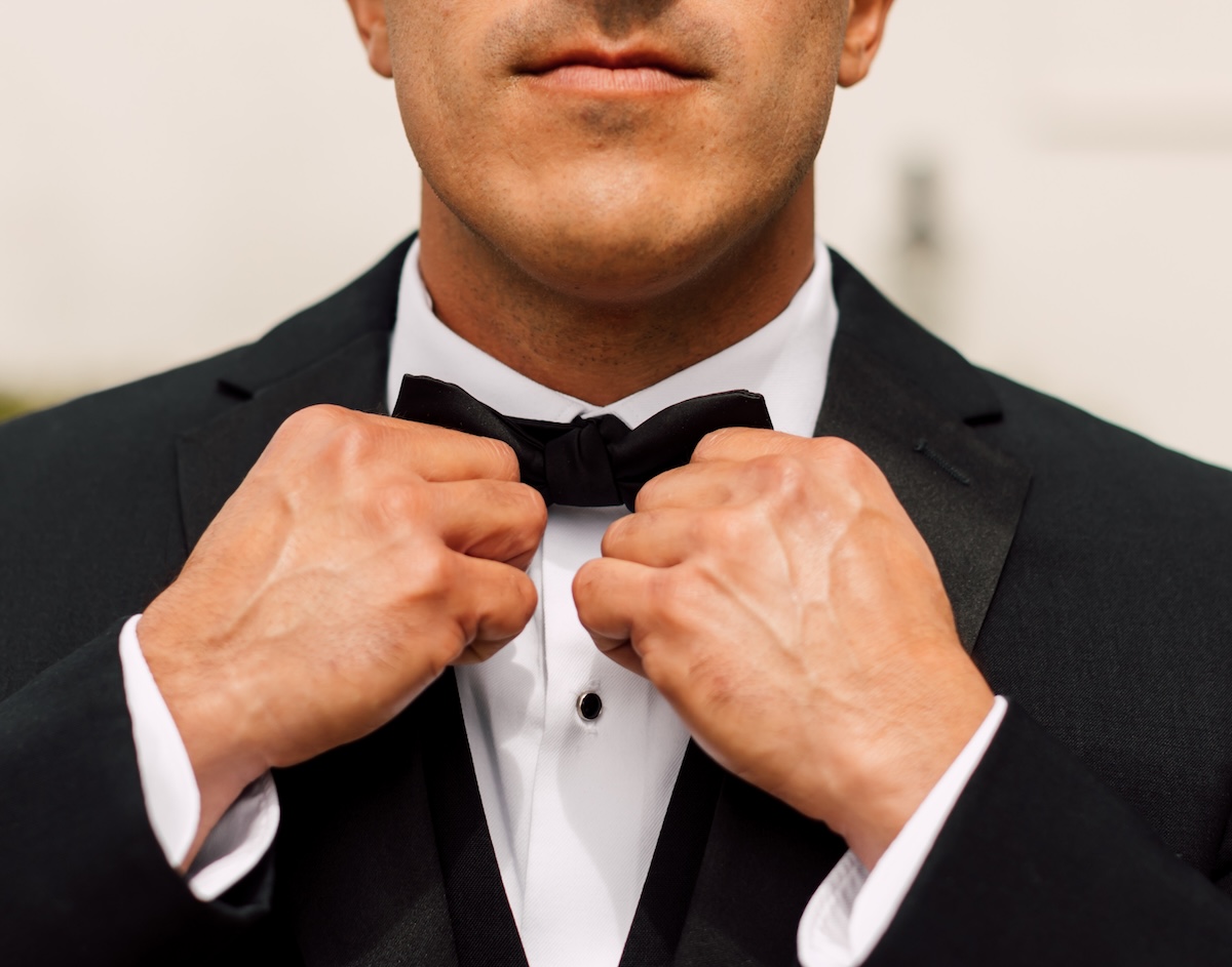 groom straightens bowtie