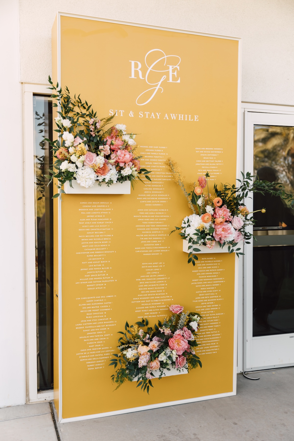 yellow escort wall for wedding with flowers