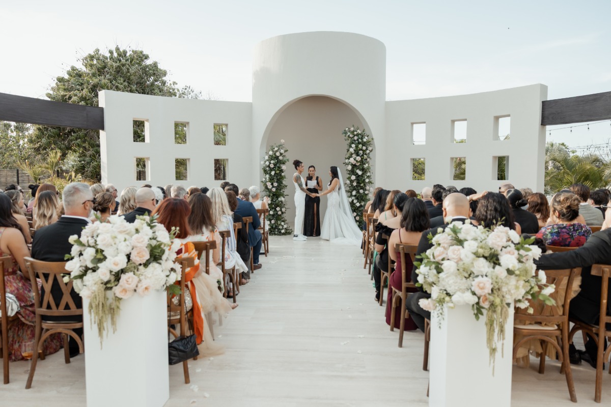 columns with dripping floral arrangements