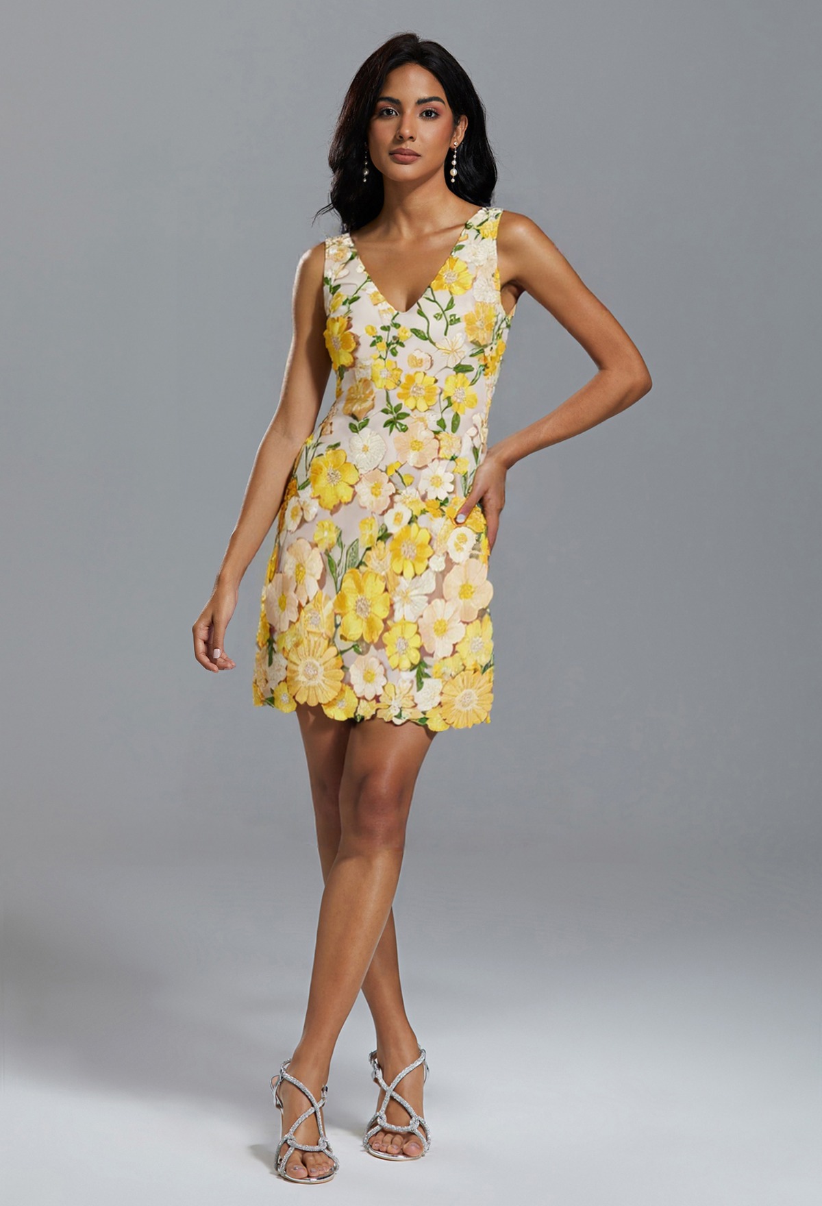 girl wearing short bridemaid dress with yellow florals