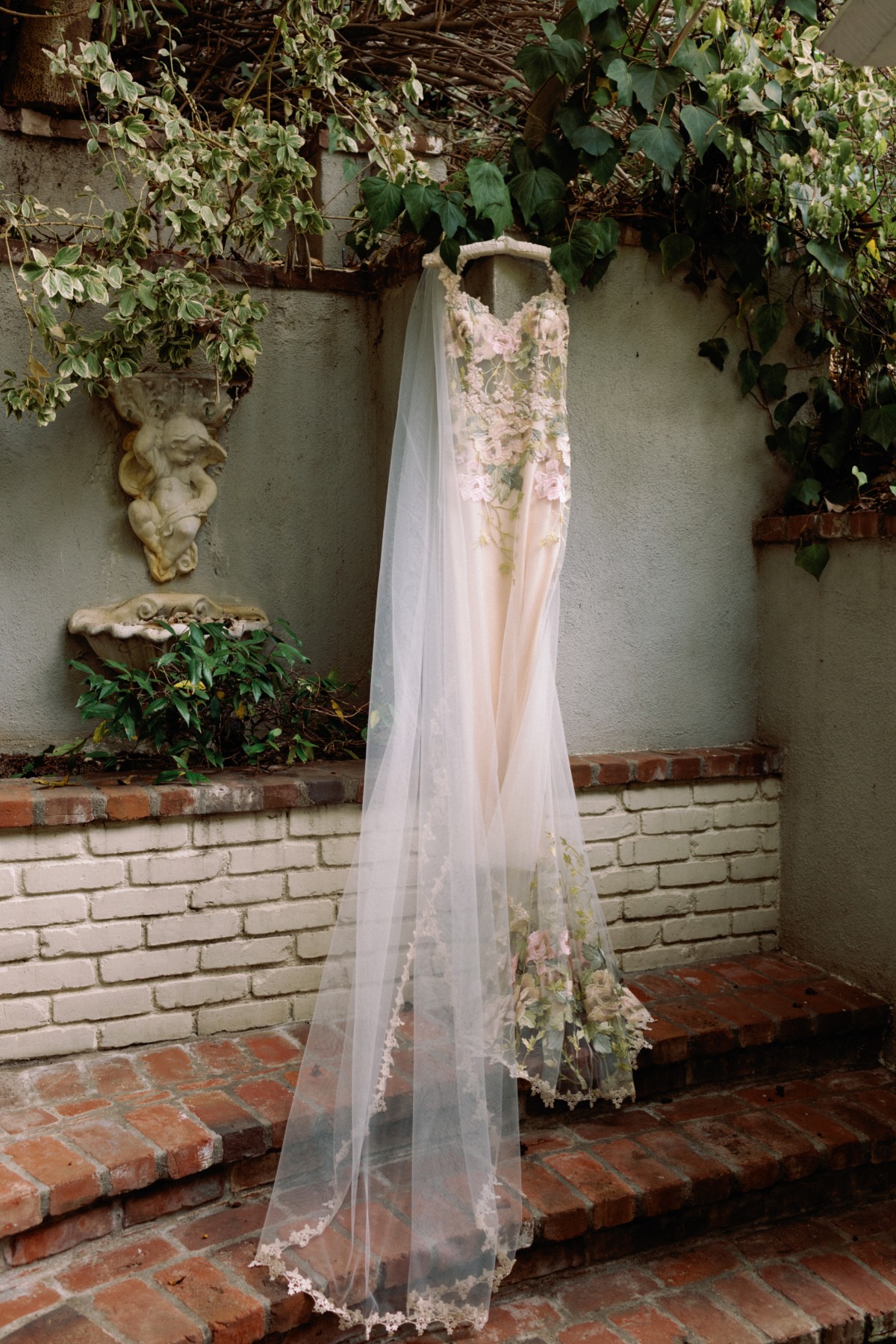 wedding dress handing from ivy 