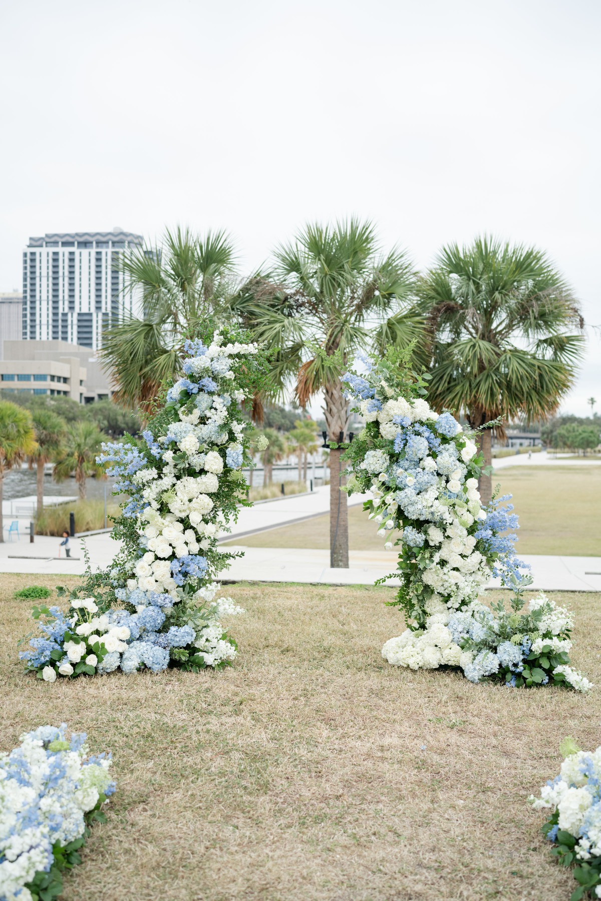 blue and white wedding floral arch 