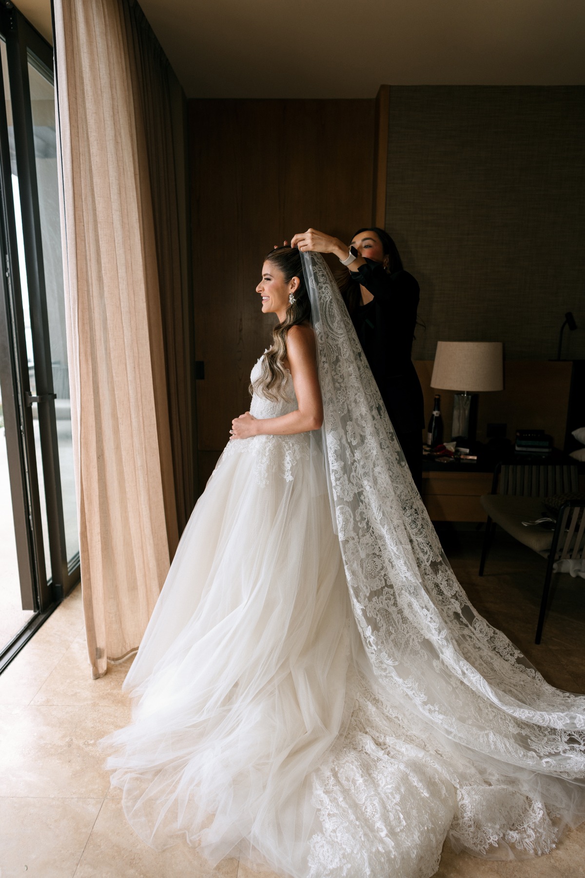 bride in vera wang gown and matching long lace veil