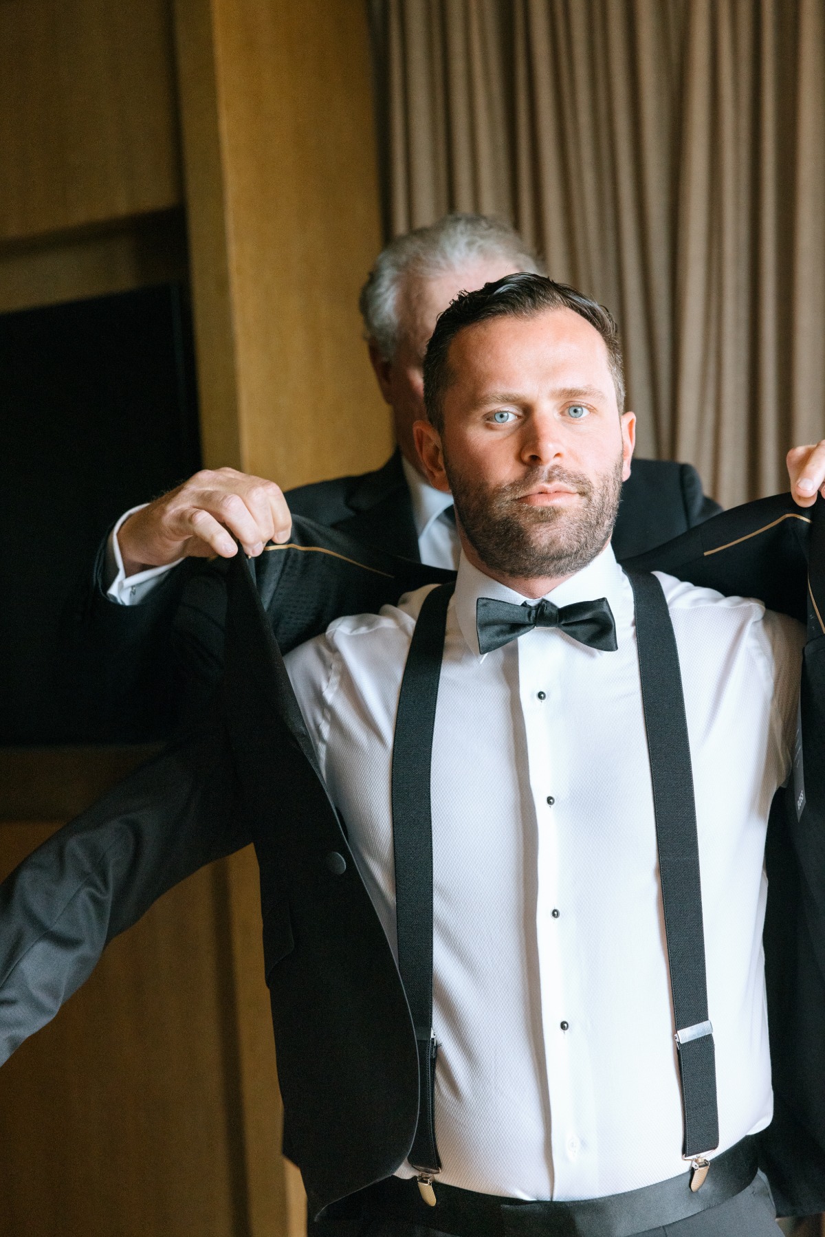 groom getting ready with his father