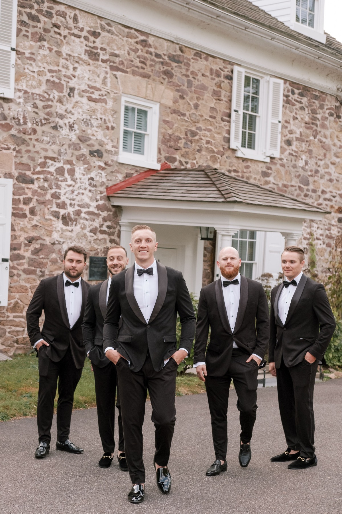 groom and groomsmen in tuxedos