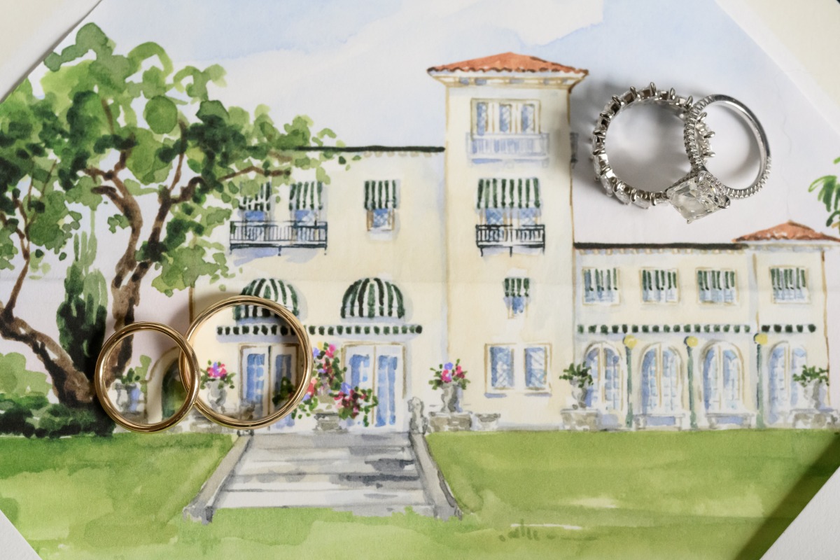 wedding ring photo with painted venue backdrop