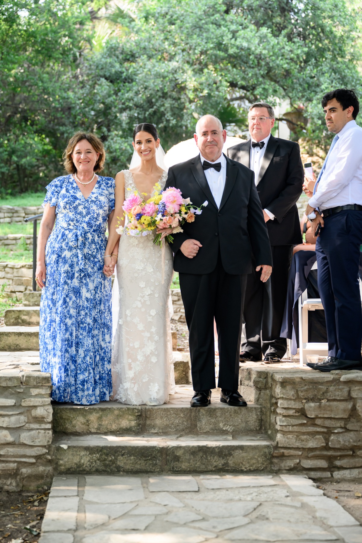 parents walking bride down the aisle