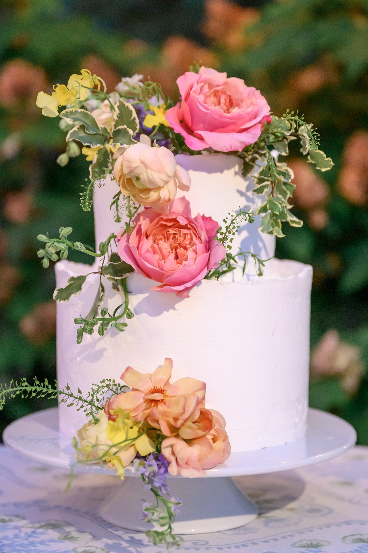 simple wedding cake with fresh flowers
