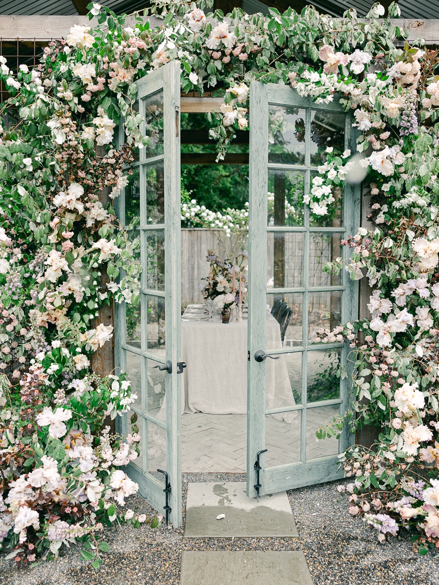 greenhouse with floral arch for wedding