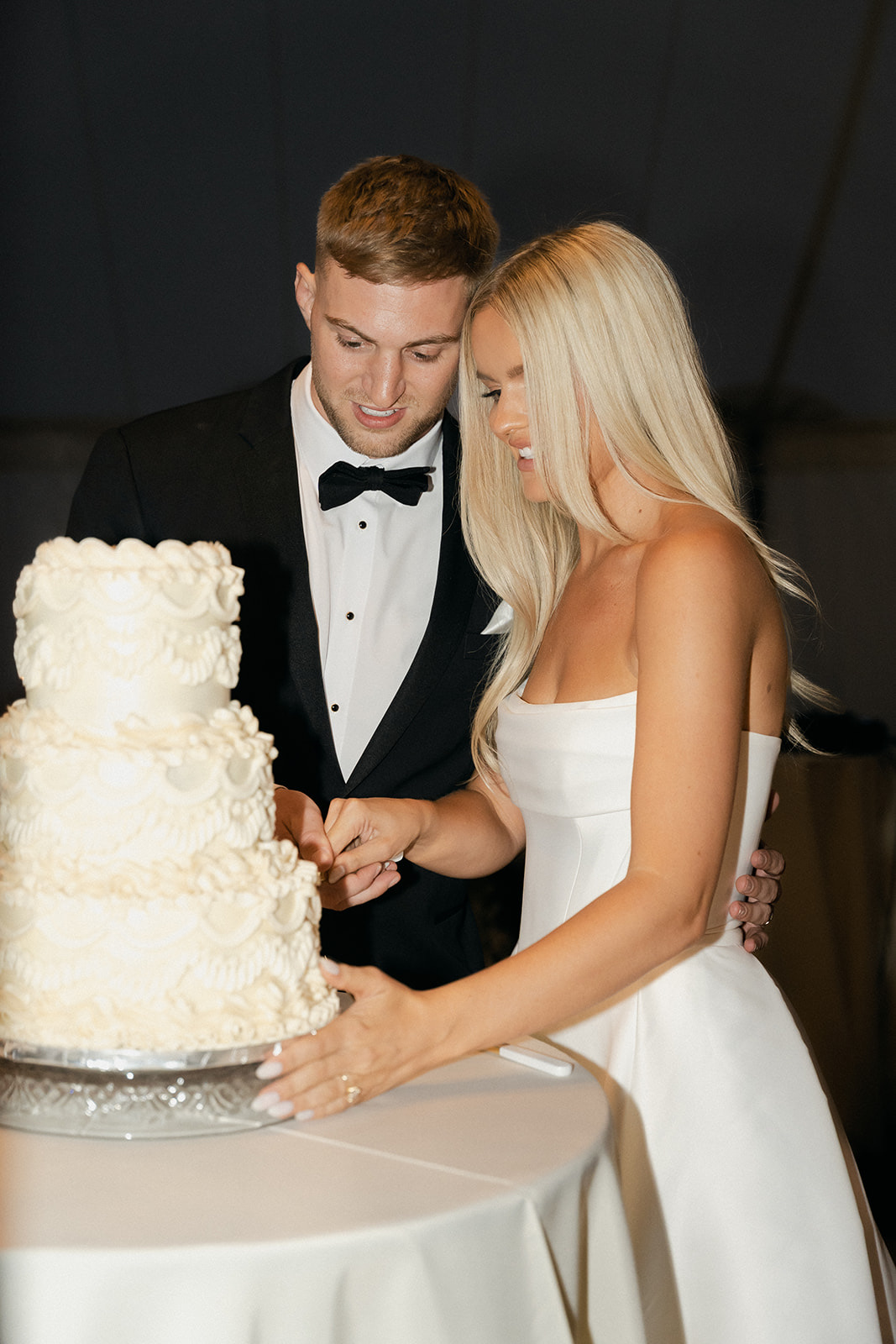 couple cutting into lambeth cake