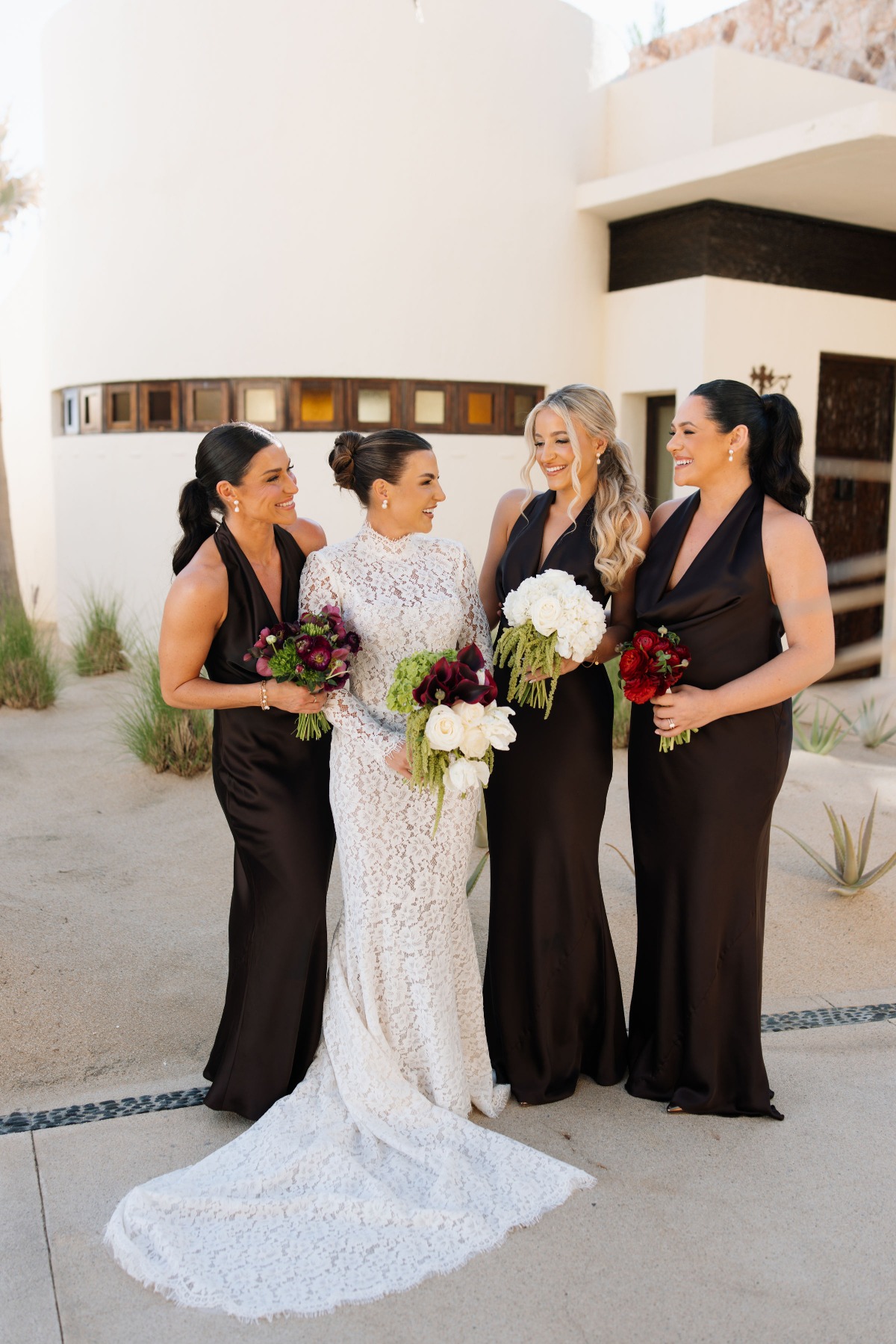 bridesmaids in black satin halter dresses