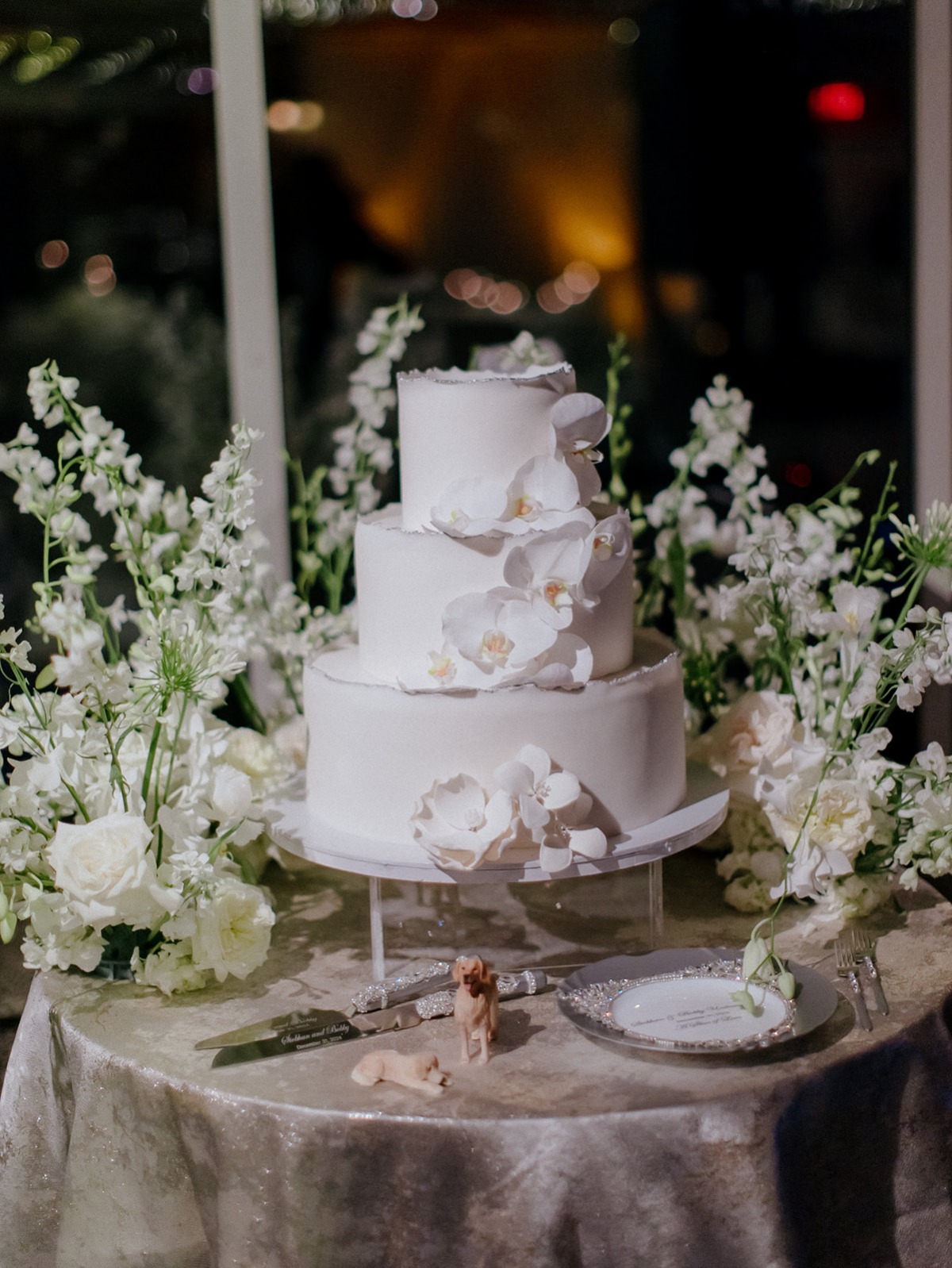 simple white wedding cake with sugar flowers