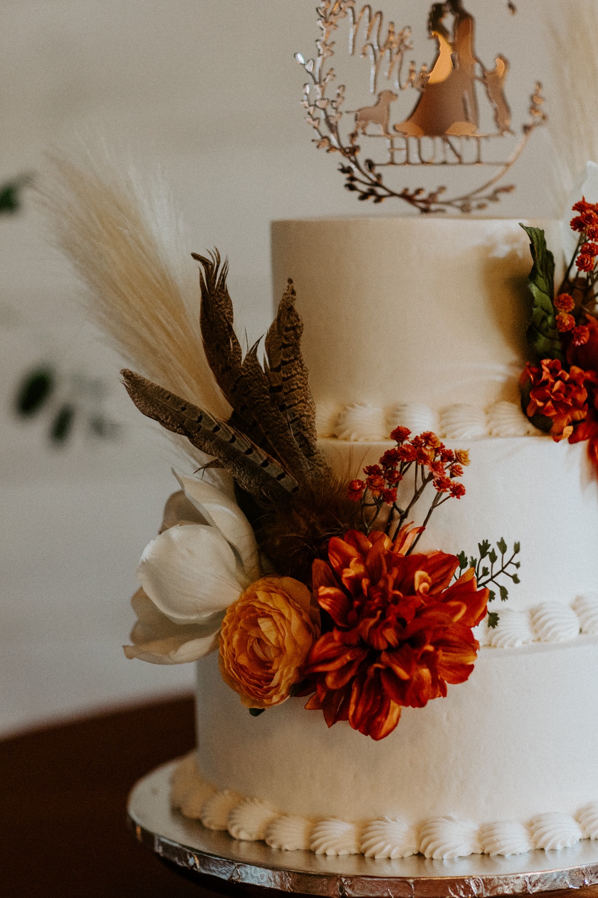 simple buttercream wedding cake with fresh flowers
