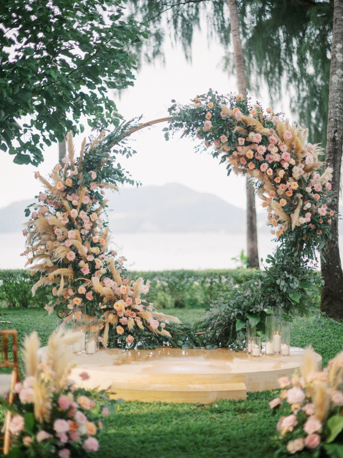 pech and blush circular wedding floral arch