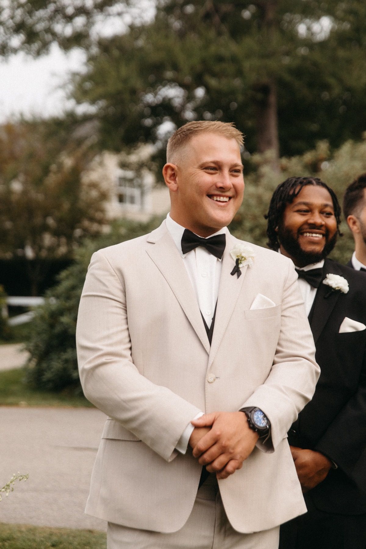 groom in tan suit