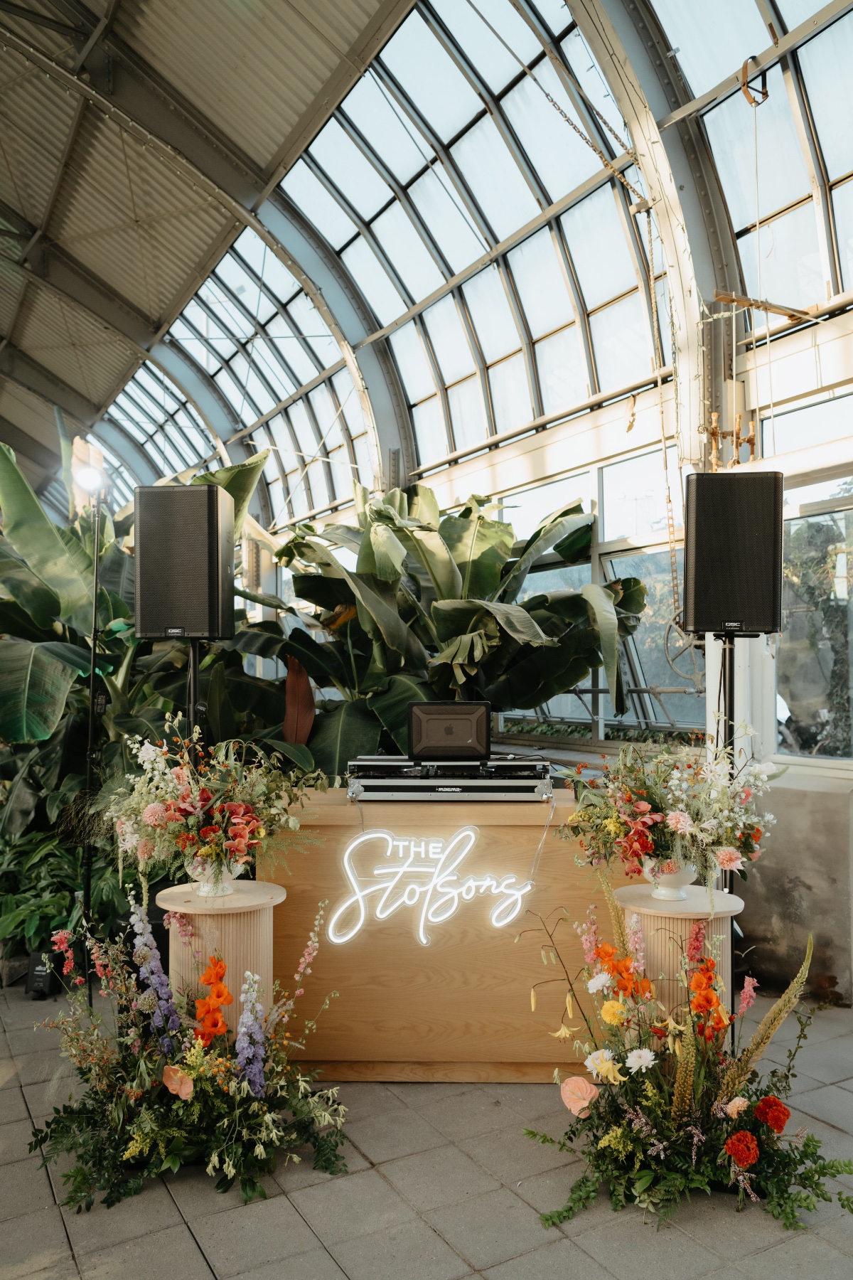 dj booth for wedding with custom neon sign