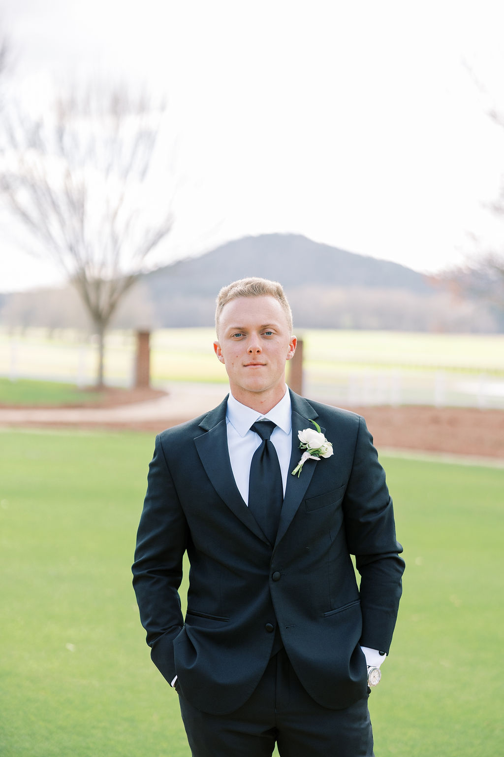 groom in black suit
