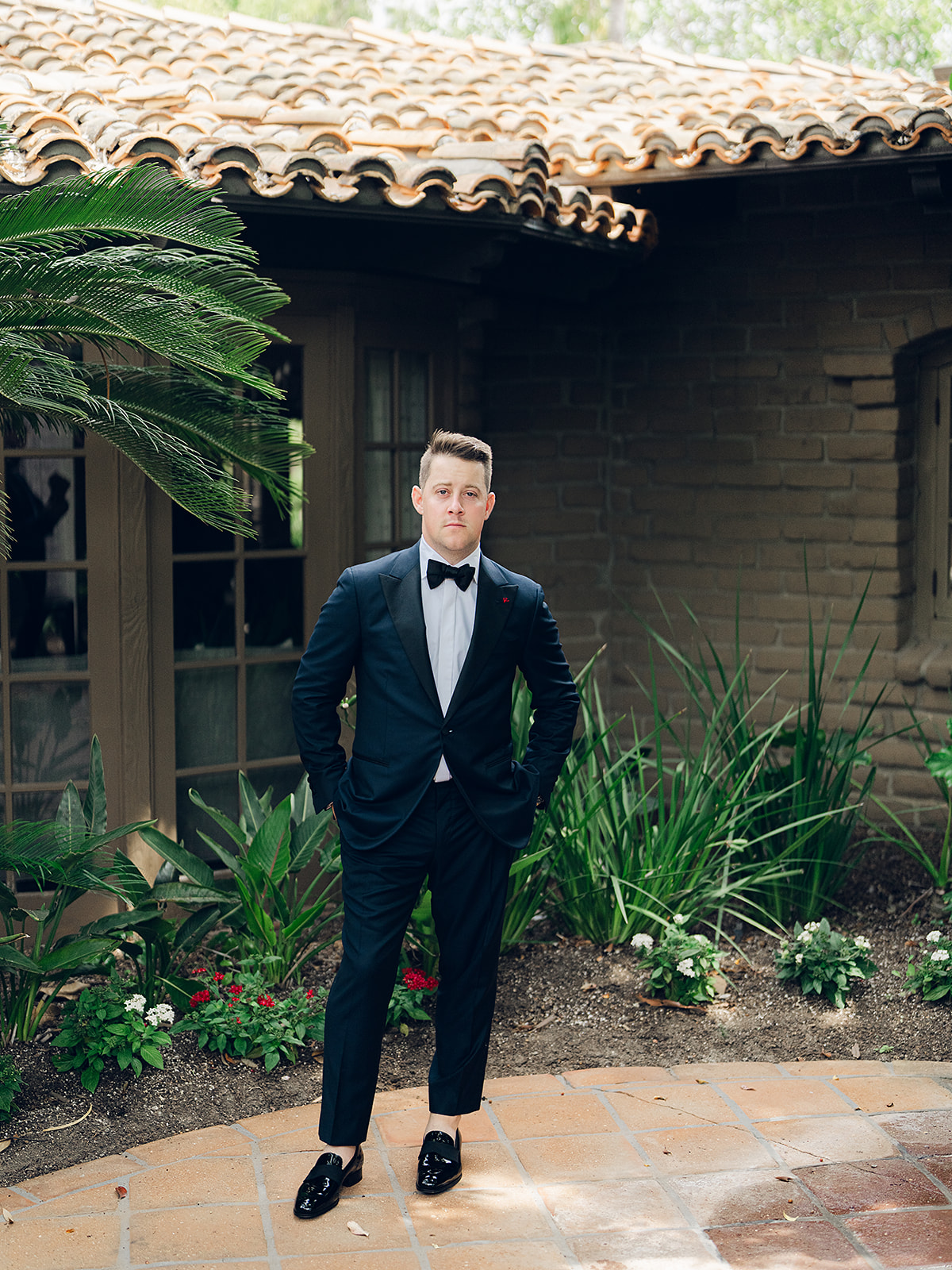 groom in navy blue tuxedo