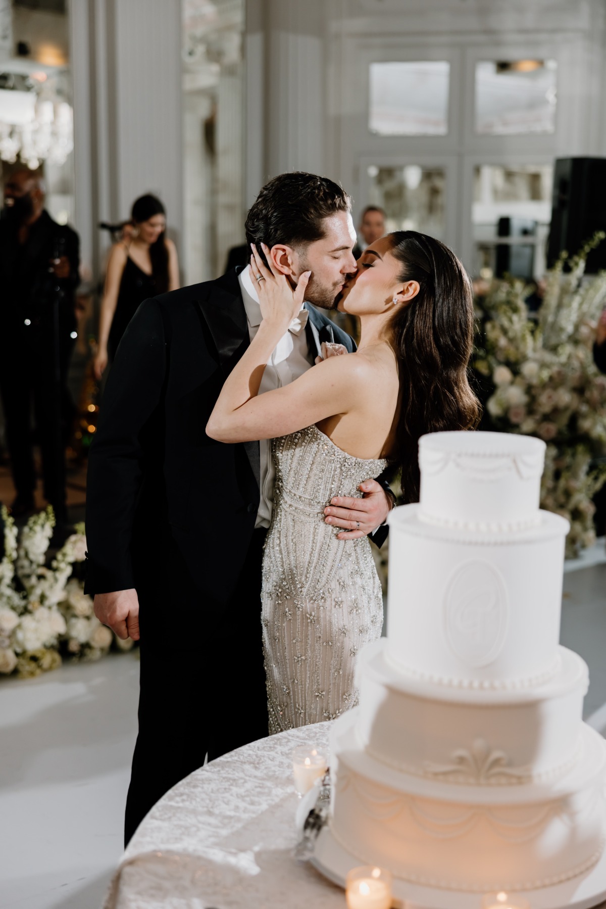 white wedding cake with bow detailing