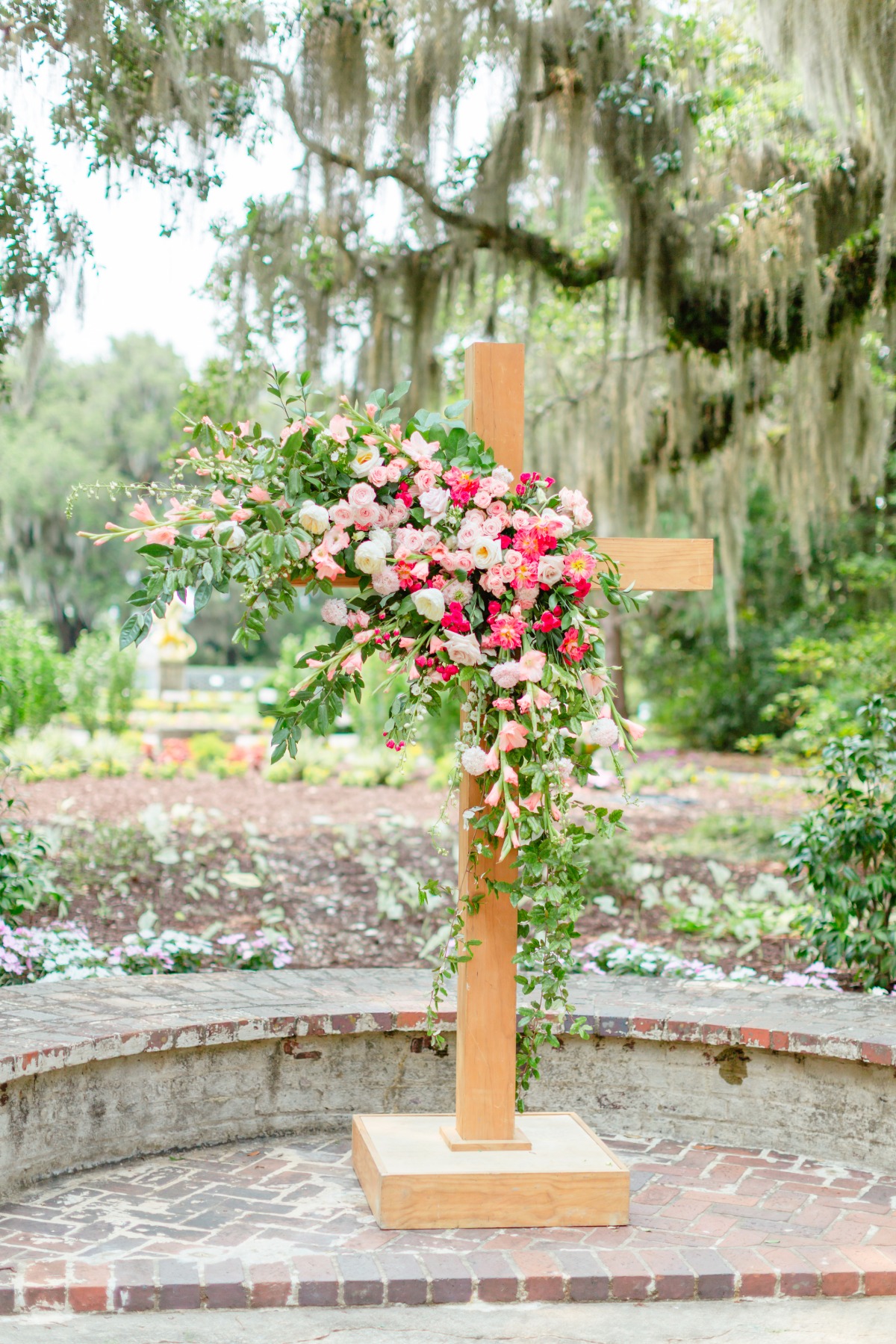 pink flowers with cross for wedding ceremony