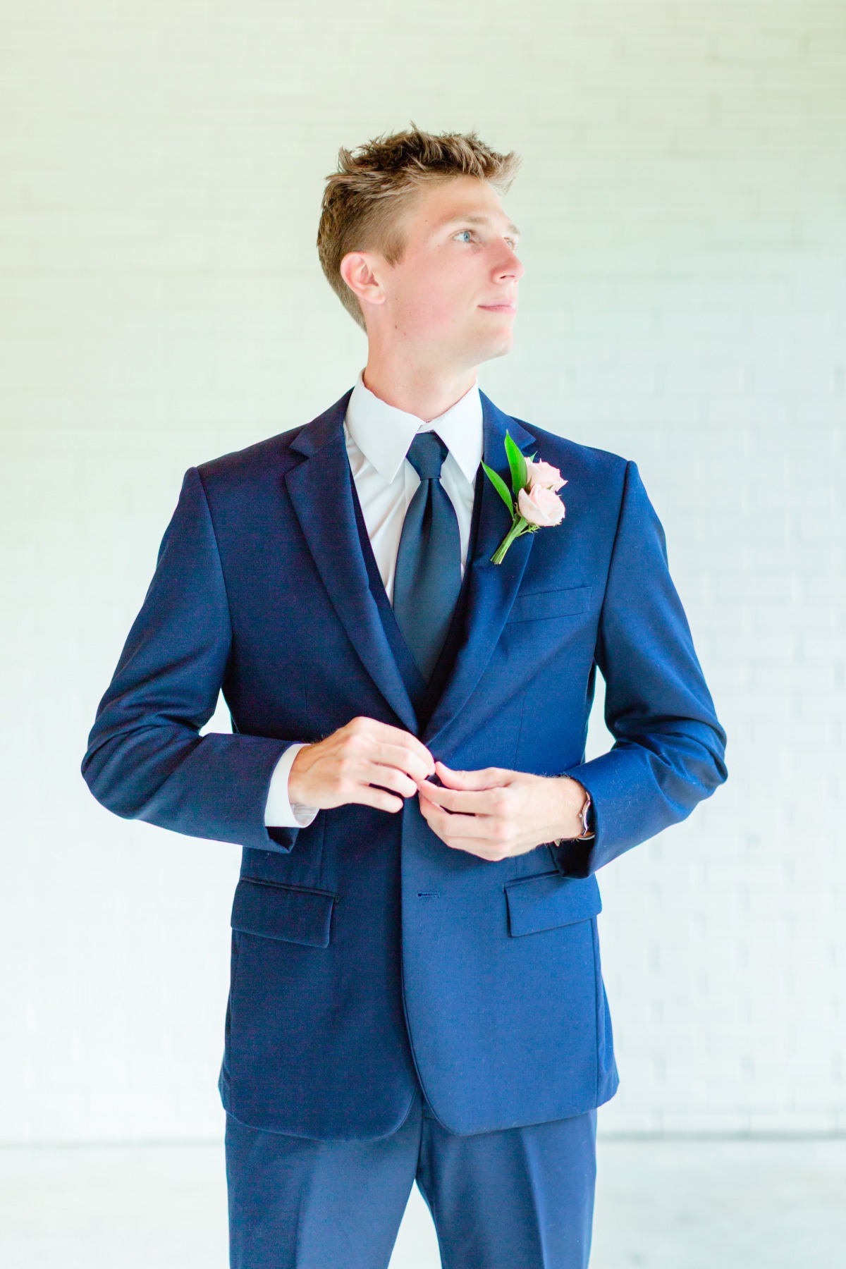 groom in blue suit