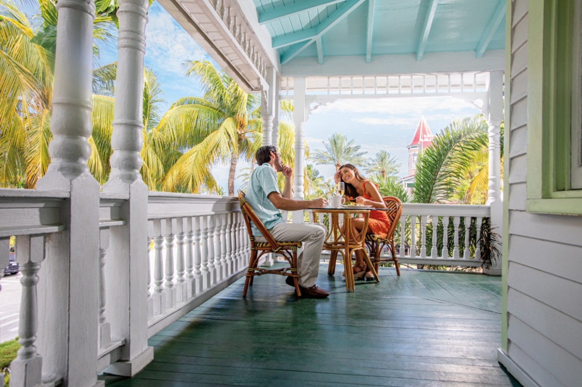 couple sitting outside eating breakfast