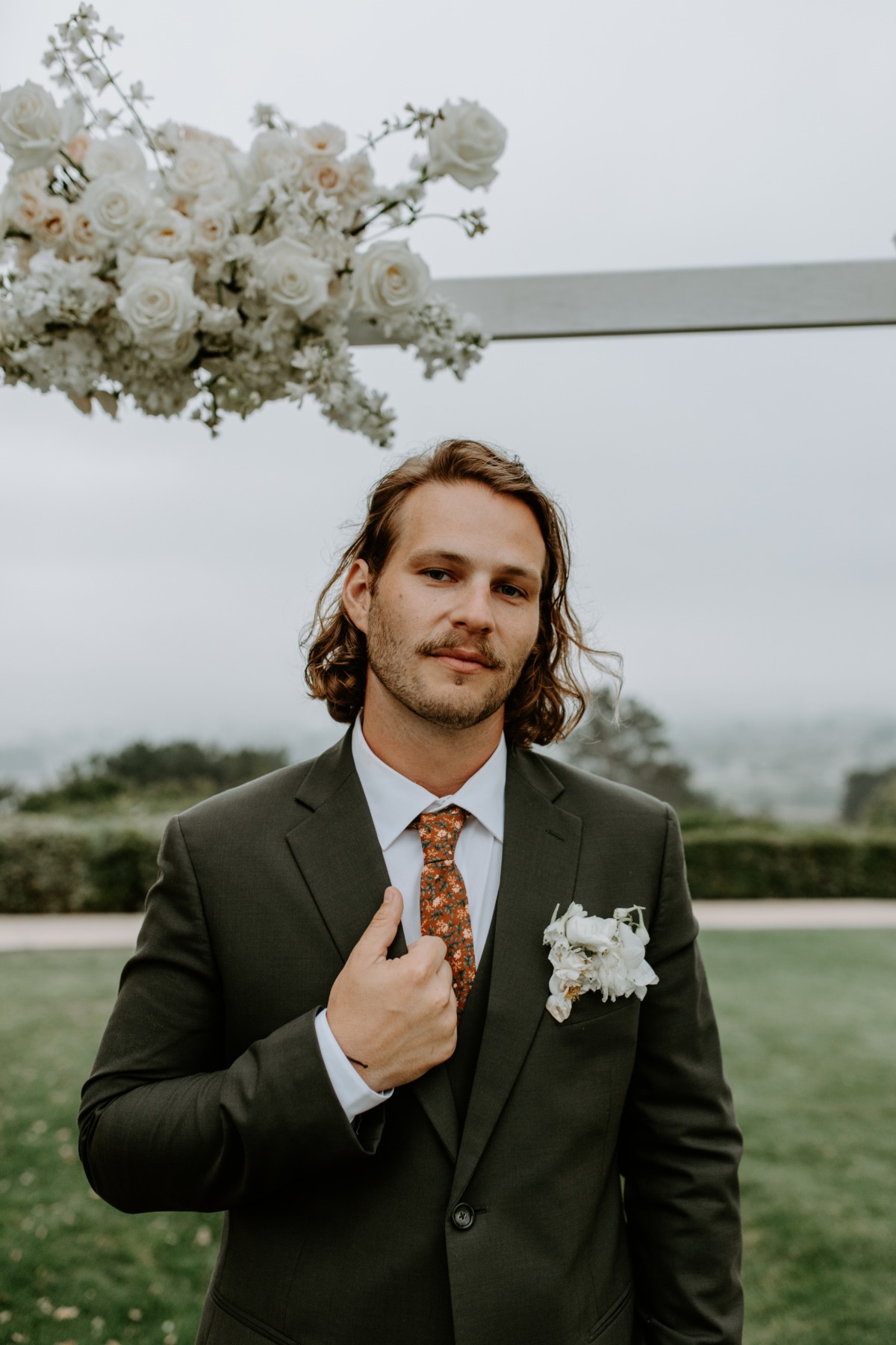 groom in olive suit