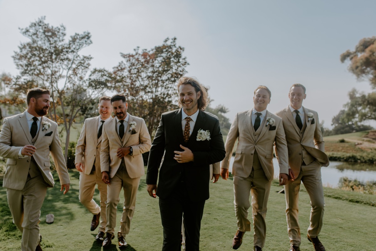 groomsmen in tan suits