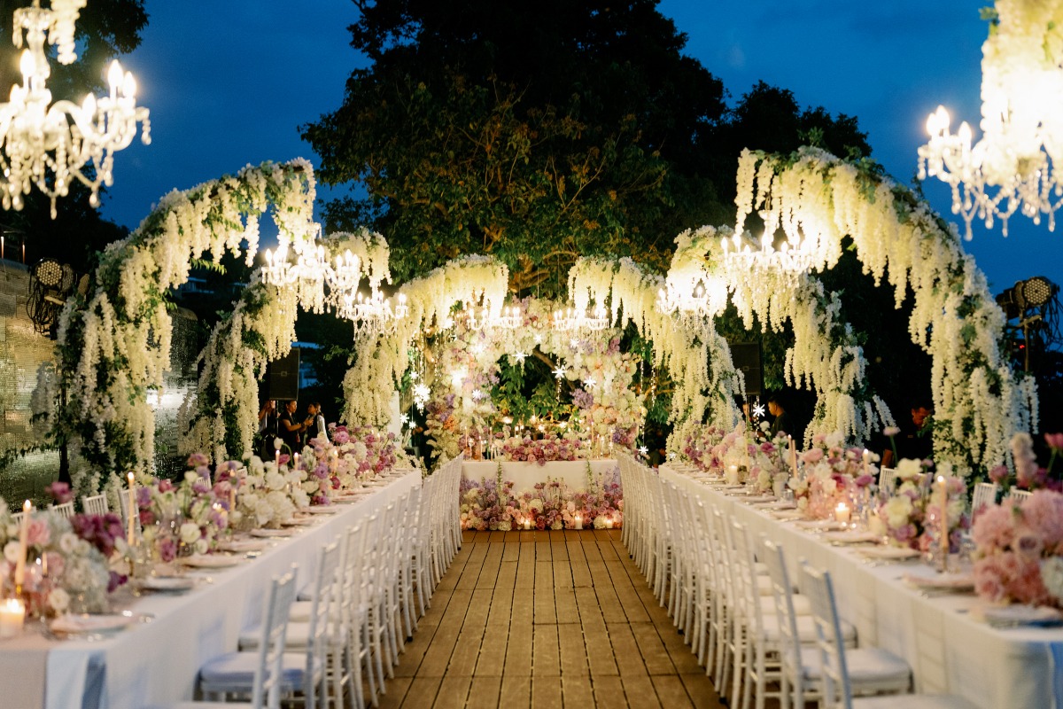 arched hanging wisteria installations with chandeliers