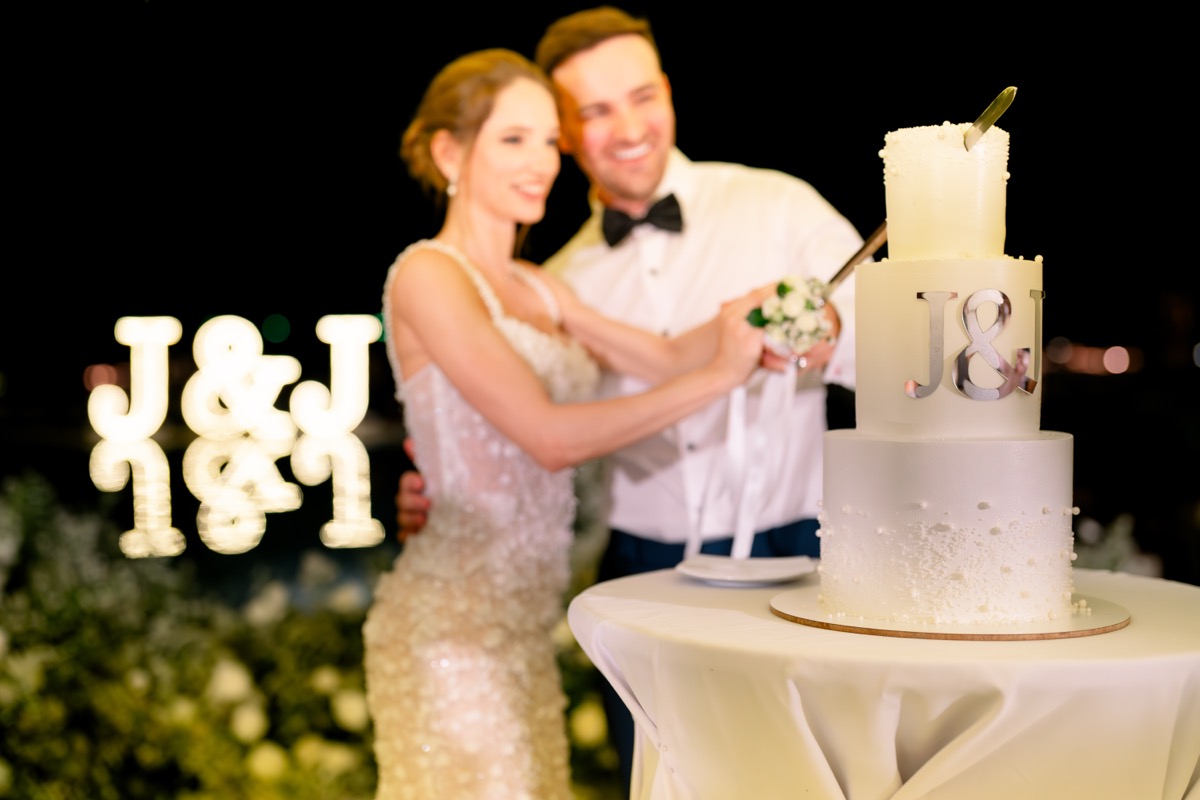 cutting wedding cake with a sword