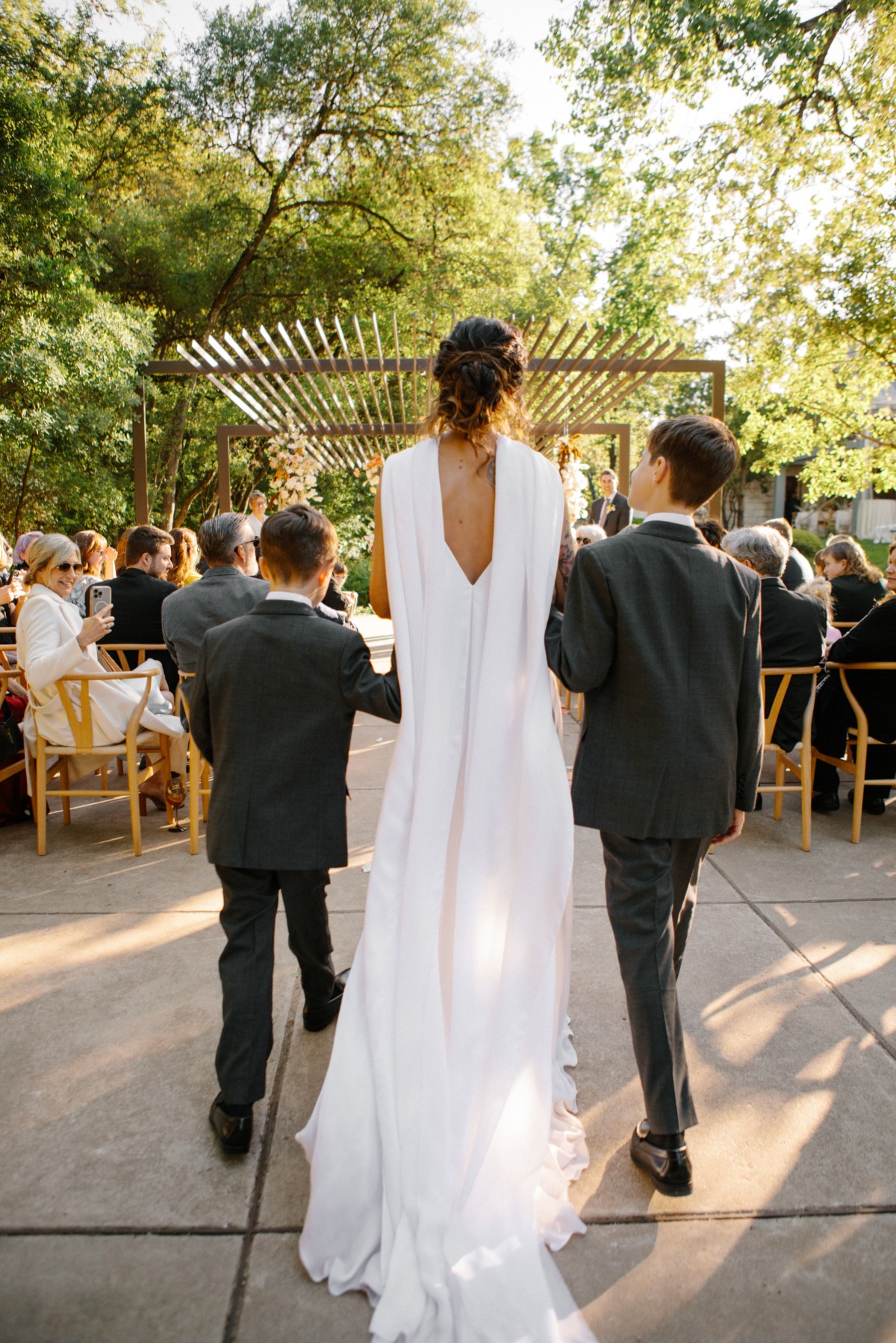 sons walk mother down the aisle