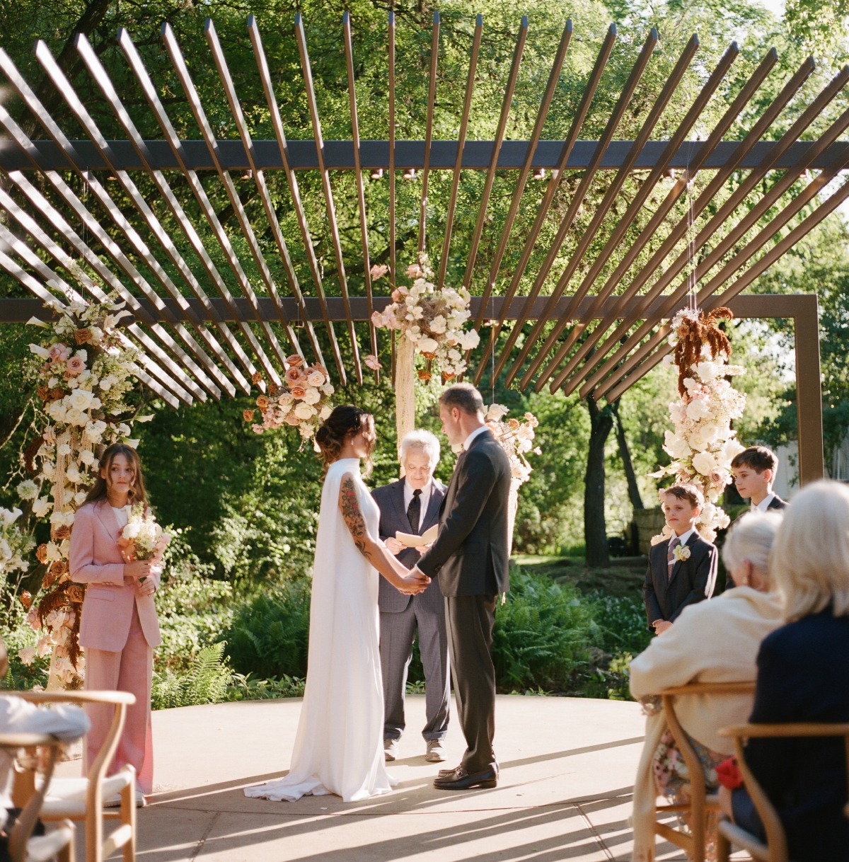 peach hanging floral installation for wedding ceremony