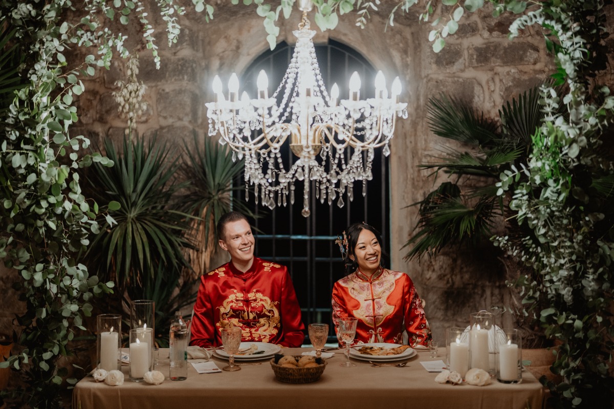 bride and groom in traditional chinese wedding ensembles
