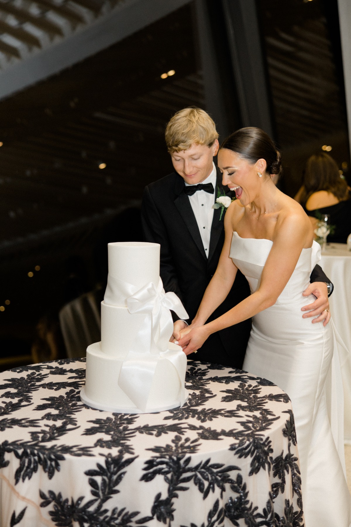 bride and groom cutting minimalist wedding cake