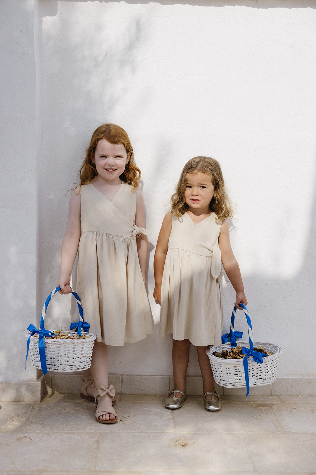 flower girls in tan linen dresses and bride in galia lahav remi gown