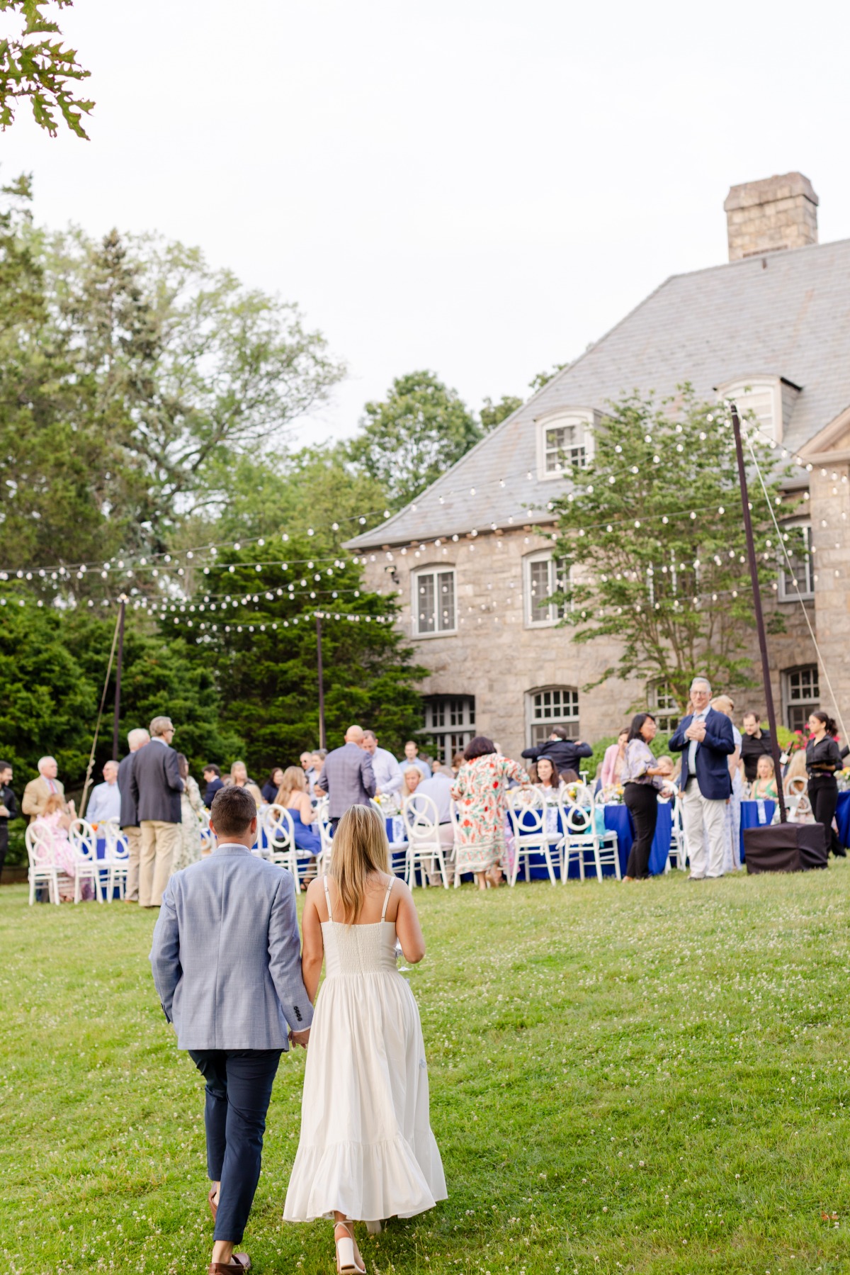 rehearsal dinner photo with couple and guests