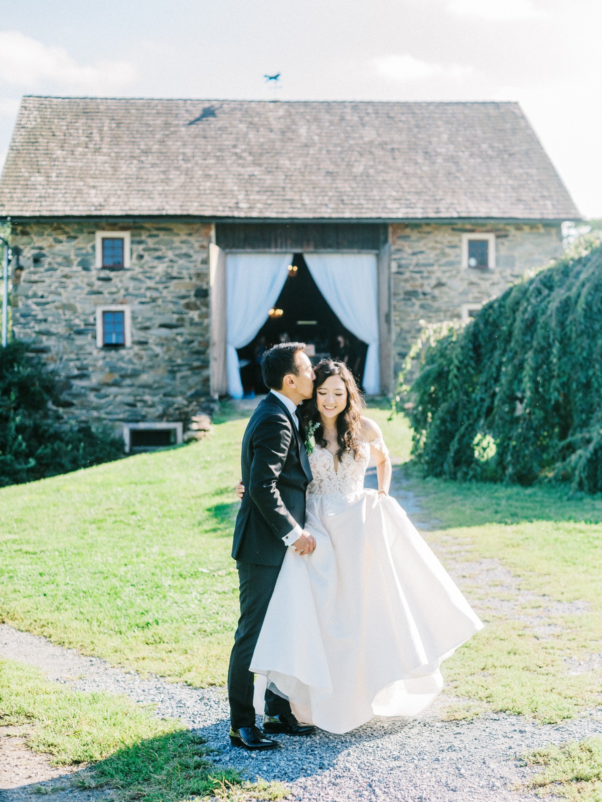 couple in front of barn venue