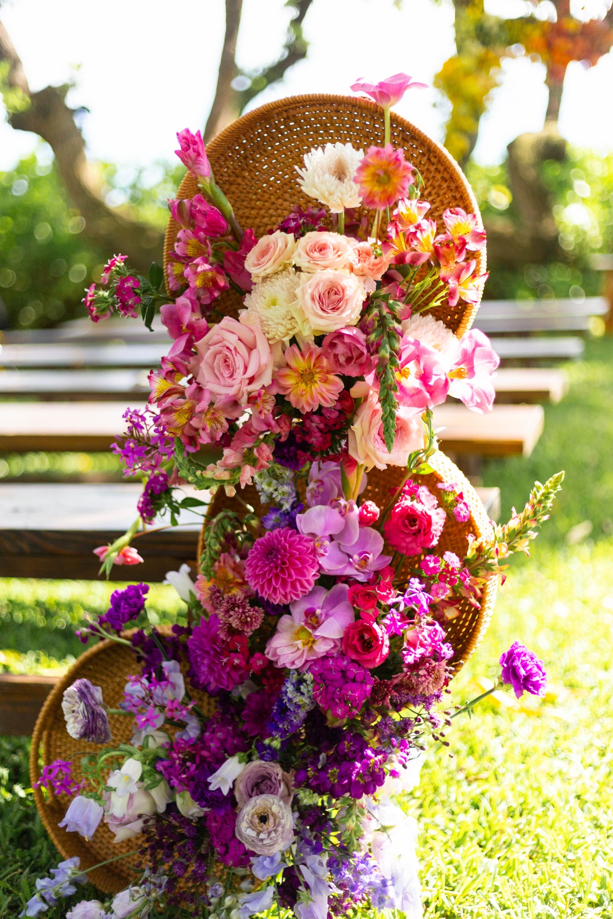 pink to purple ombre flower basket arrangement