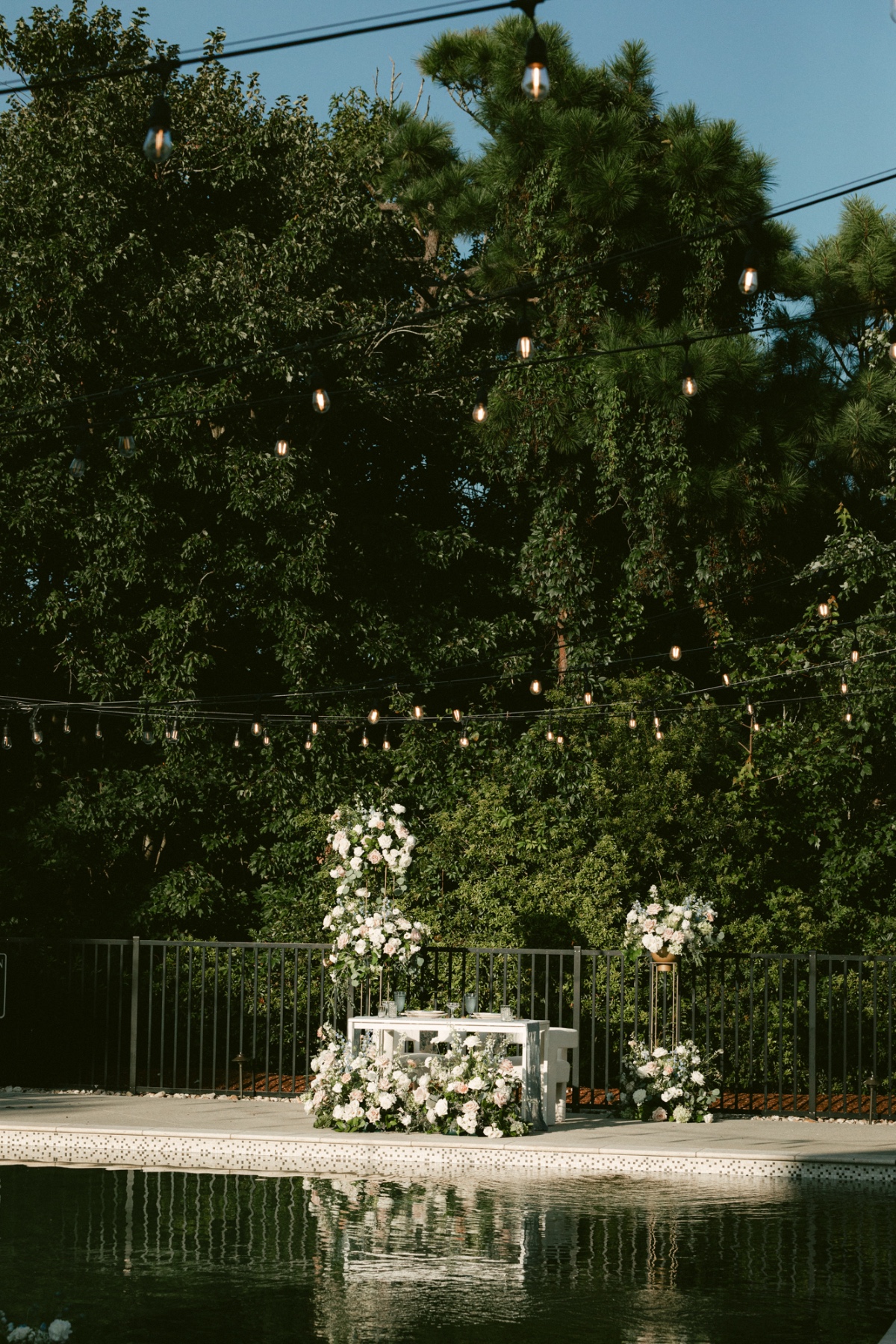 repurposed ceremony flowers for sweetheart table