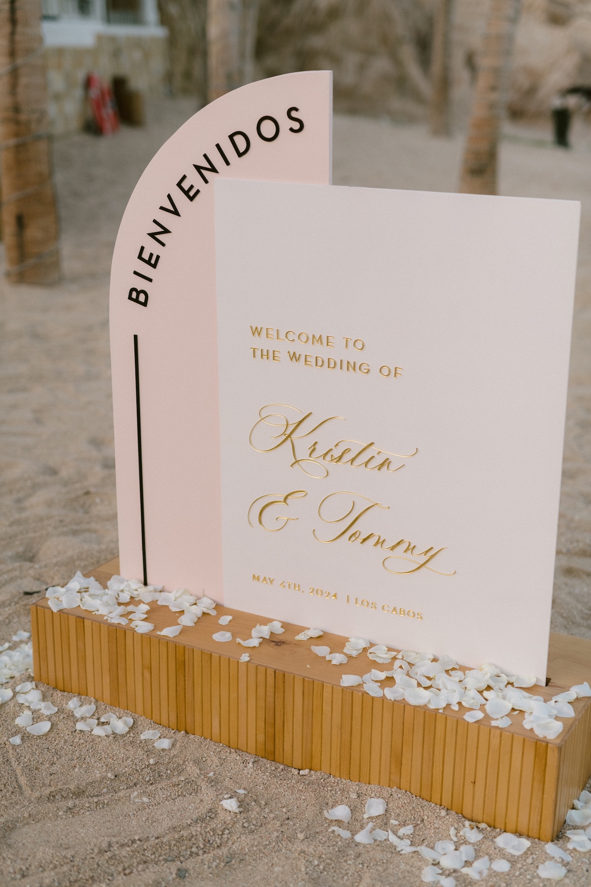 neutral off-white and light pink welcome sign