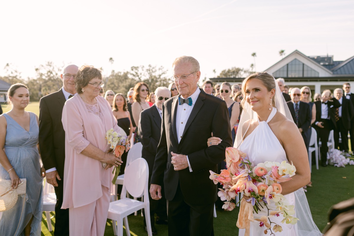 father of the bride walking her down the aisle