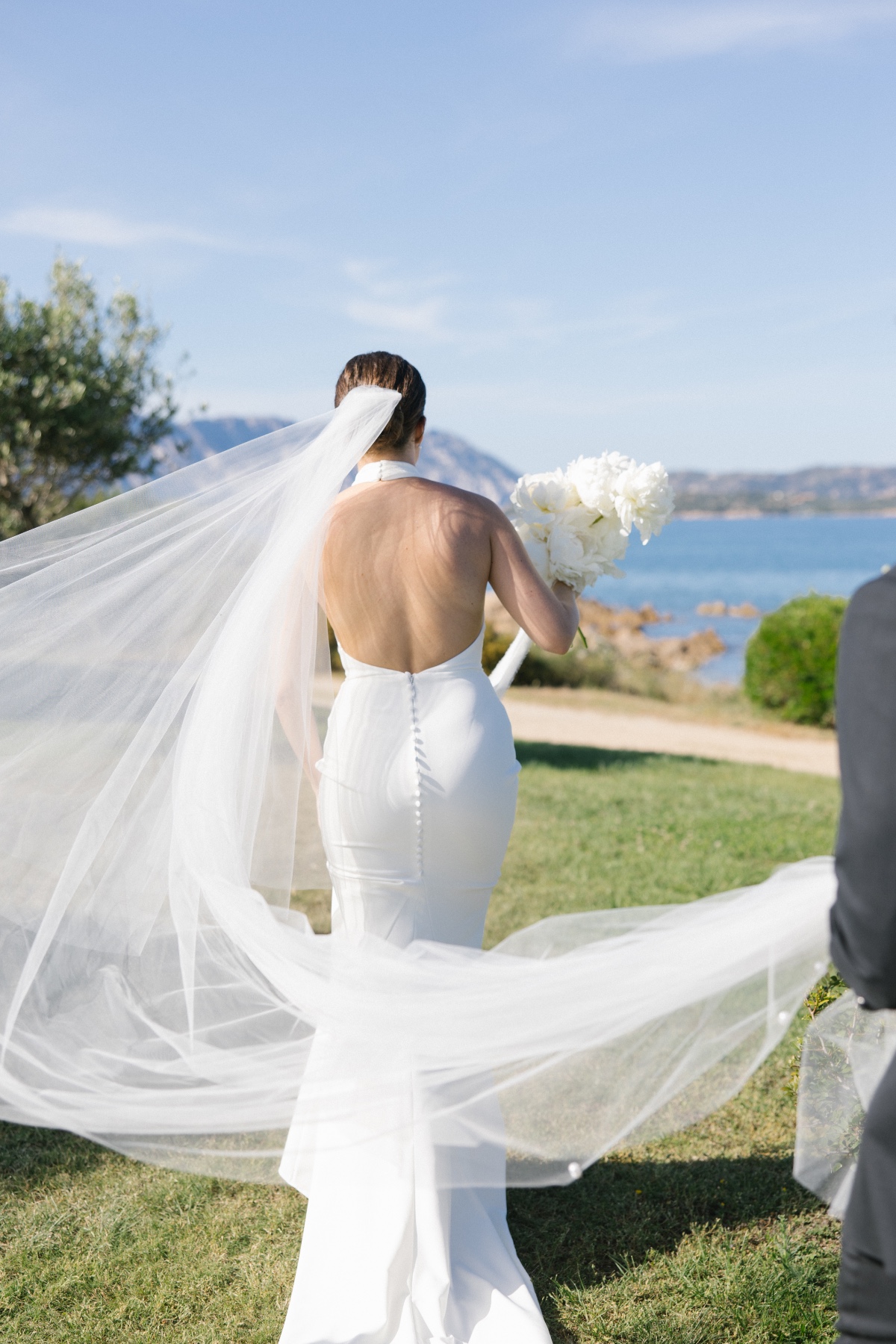 bride with veil blowing in the wind