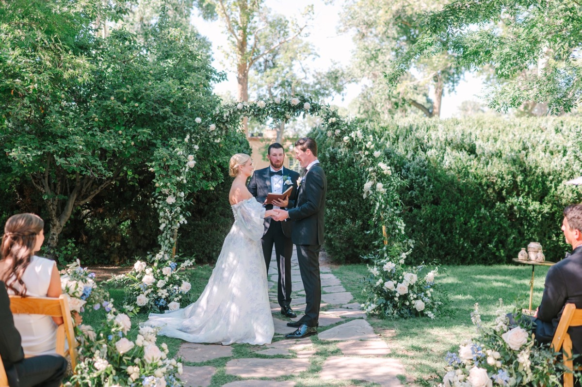 asymmetrical white and greenery floral columns