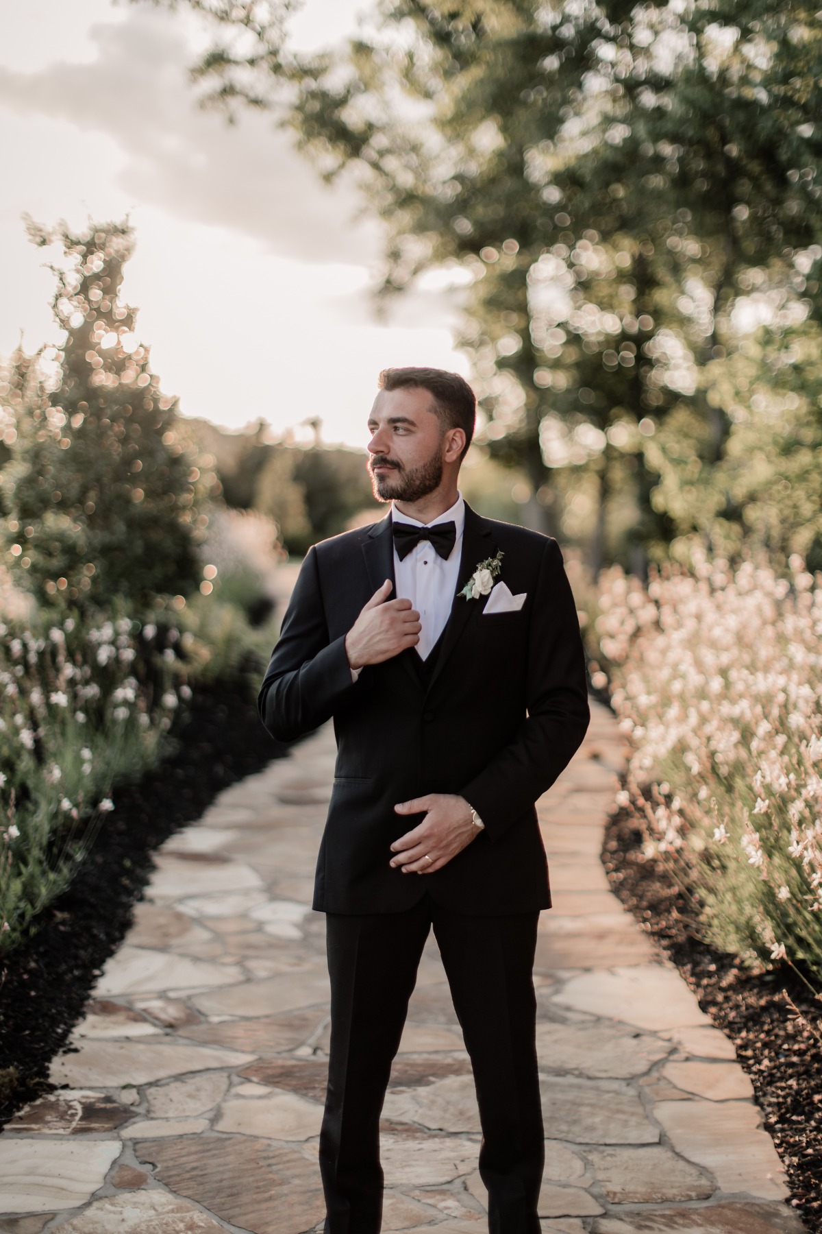 groom in tux for garden wedding